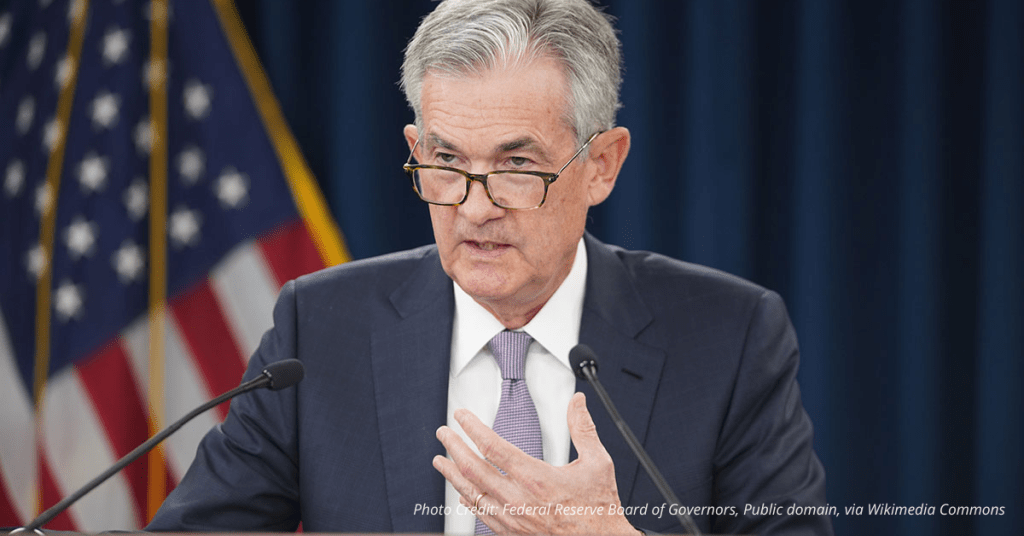 Jerome Powell speaks at a Federal Reserve event, symbolizing economic policy decisions impacting small business