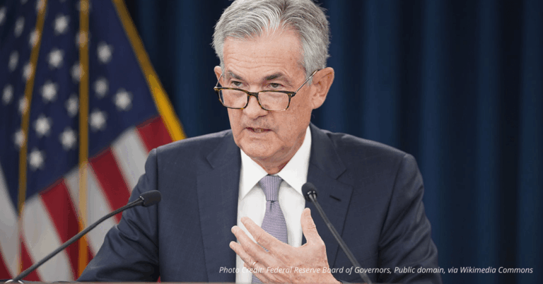 Jerome Powell speaks at a Federal Reserve event, symbolizing economic policy decisions impacting small business