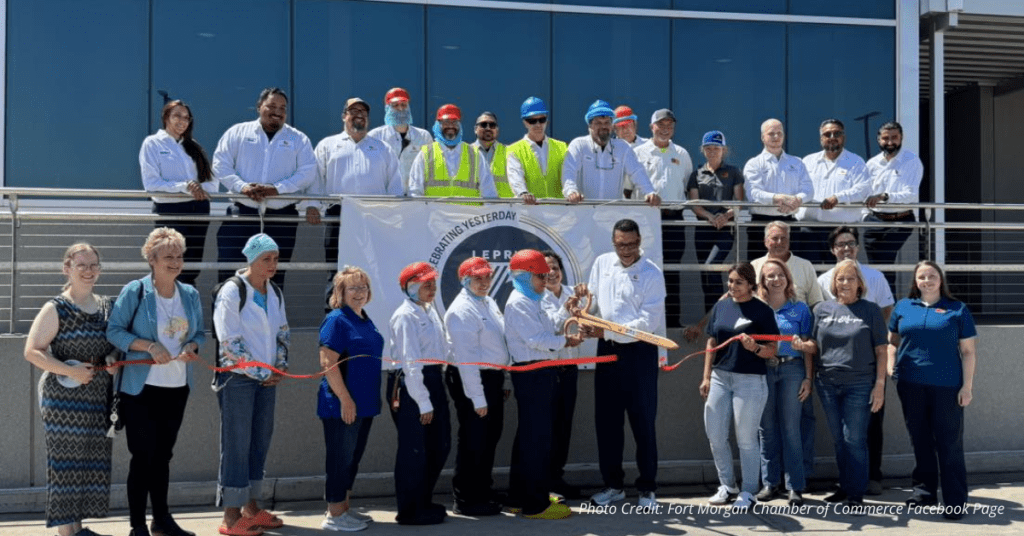 Leprino Foods team and Fort Morgan leaders cut ribbon in front of facility