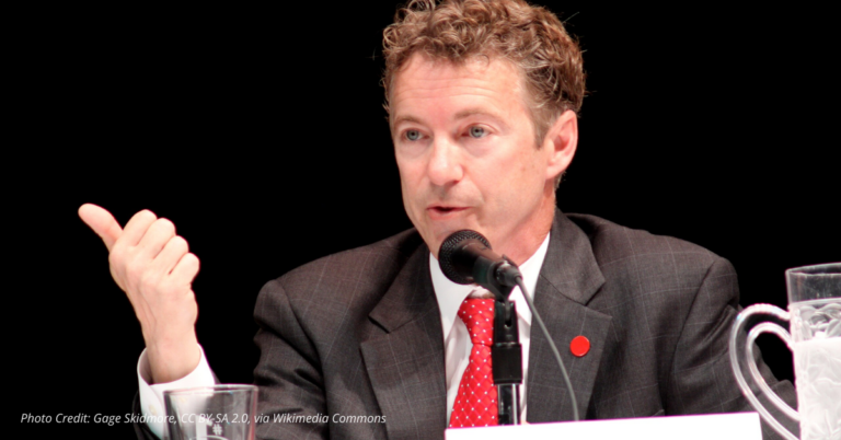 Sen. Rand Paul speaking outdoors with focused expression, symbolizing his call to audit the Federal Reserve