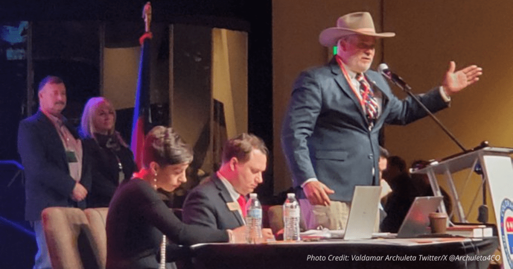 Richard Holtorf speaks at Colorado GOP March 2025 assembly in cowboy hat and suit