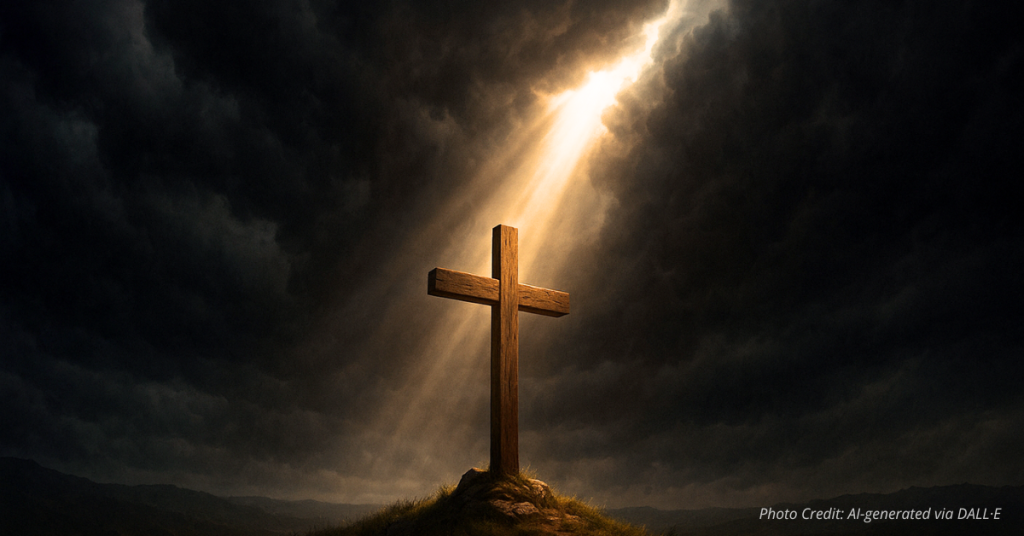 Light shines on a cross through storm clouds
