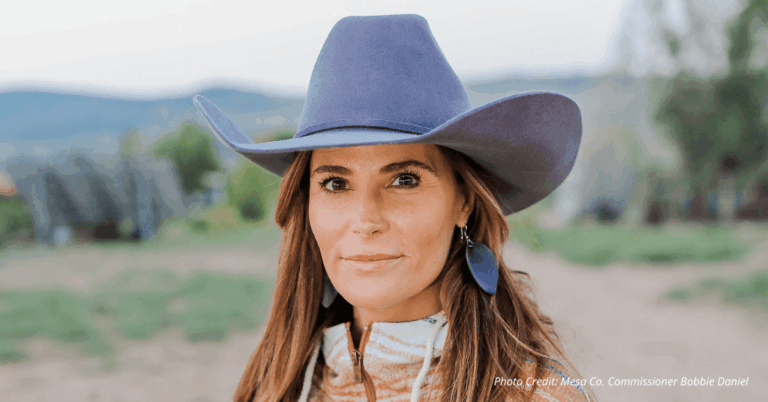 Mesa County Commissioner Bobbie Daniel wearing a cowboy hat, standing outdoors