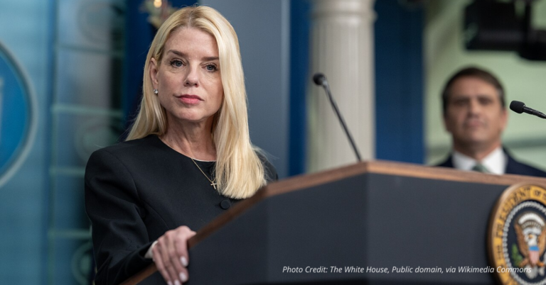 Pam Bondi speaks at the White House podium during a DOJ press briefing on election integrity in June 2025