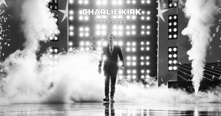 Charlie Kirk walks on-stage