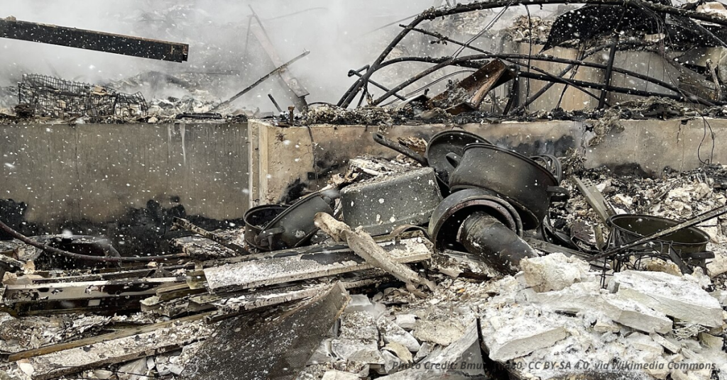 Burned home remains with charred debris after the Marshall Fire