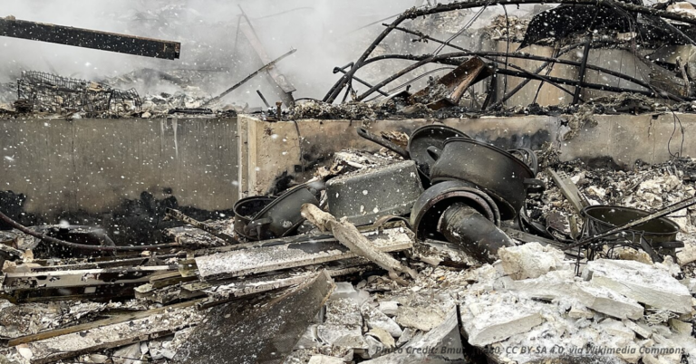 Burned home remains with charred debris after the Marshall Fire