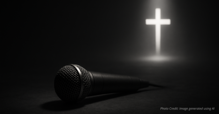 Fallen microphone with cross glowing in distance