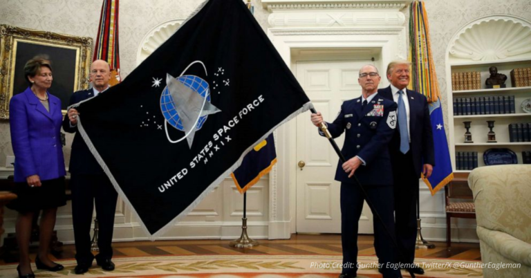 Trump and military leaders hold Space Force flag as command moves from Colorado to Alabama