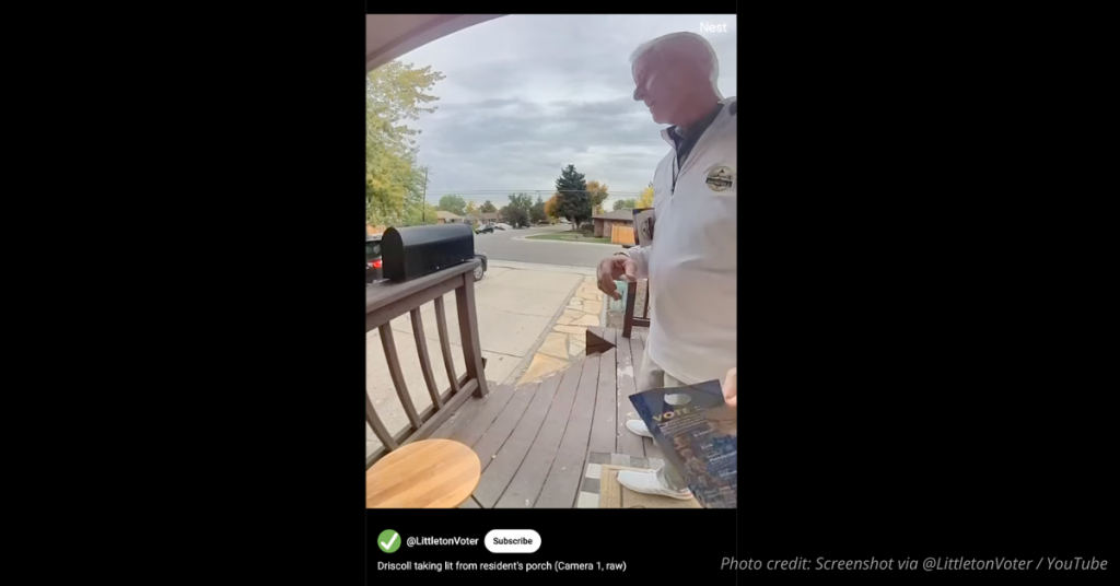 Littleton mayoral candidate Patrick Driscoll seen taking campaign flyer from resident’s porch