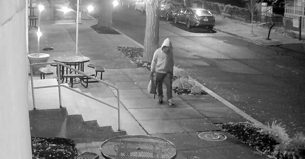 Person walking alone at night DNC bomber walking on DC sidewalk.
