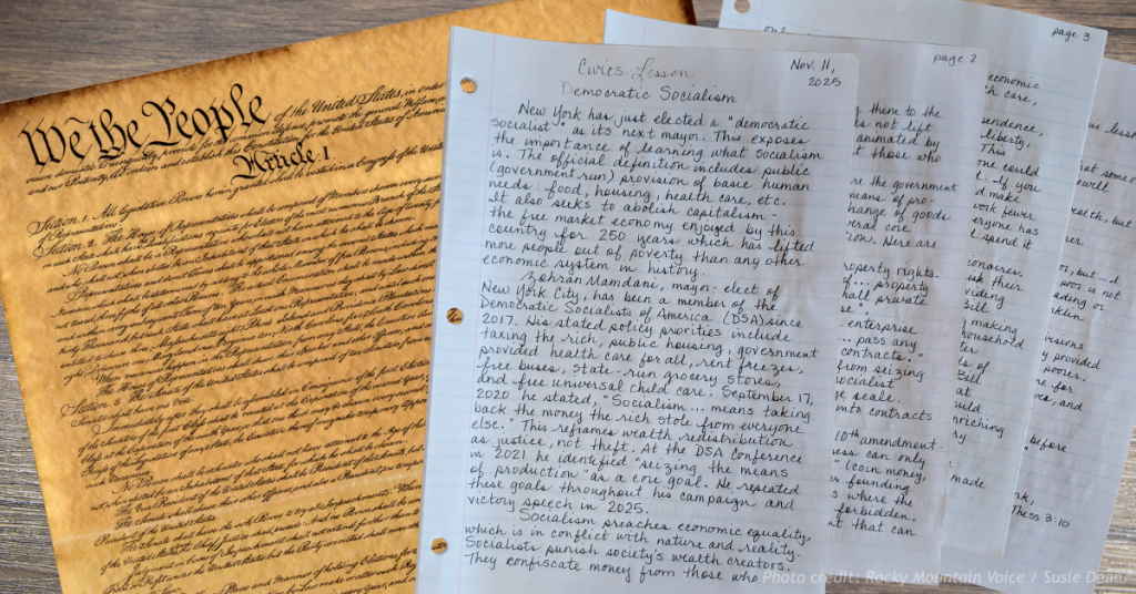 Handwritten civics lesson placed beside the U.S. Constitution