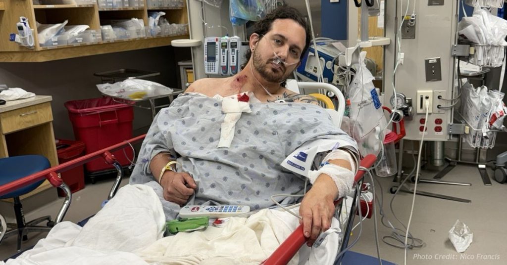 Nico Francis in hospital bed recovering after being shot in downtown Denver