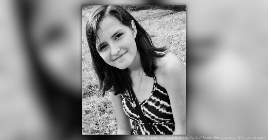 Black-and-white portrait of Alexis “Lexi” Arguello smiling outdoors.