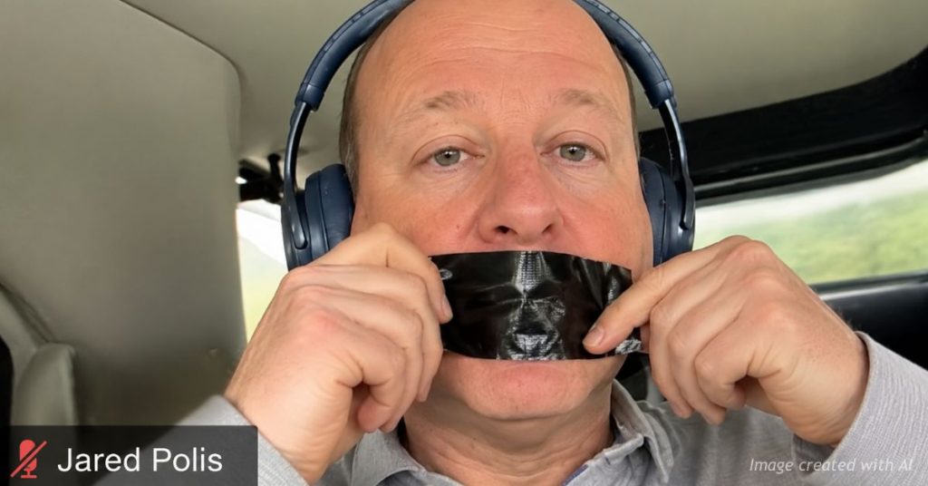 Jared Polis places black tape over his mouth during a Zoom meeting after backlash over Tina Peters clemency.