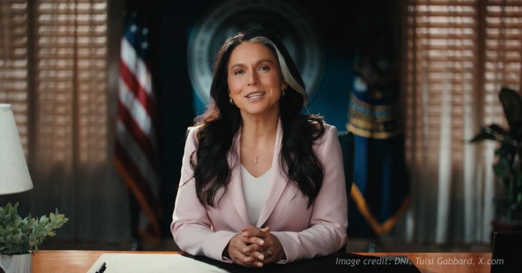Tulsi Gabbard speaks from her desk as Director of National Intelligence
