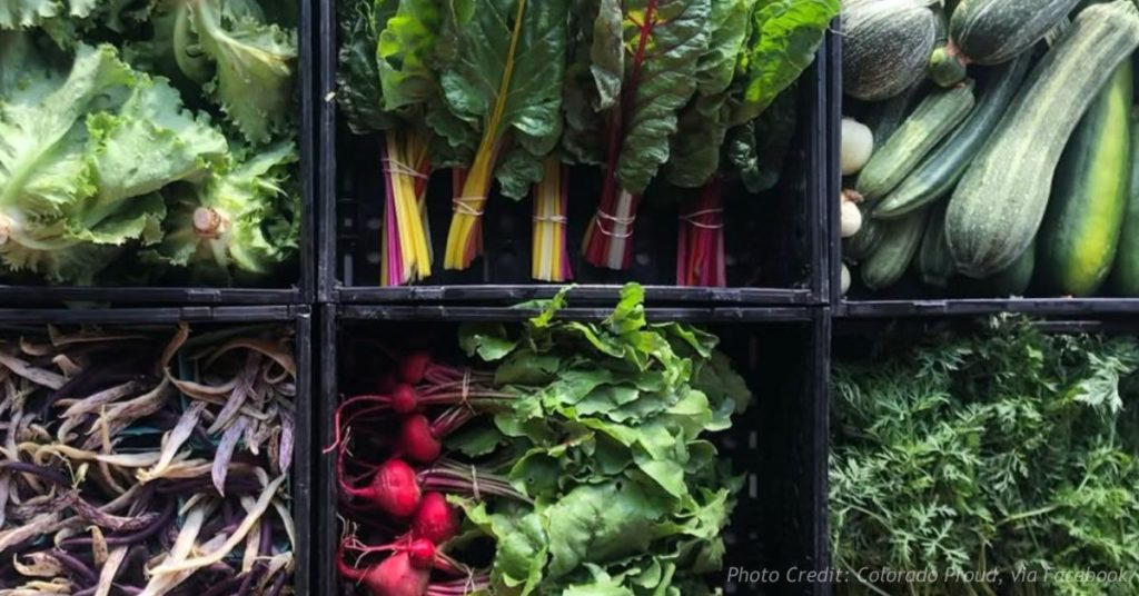 Fresh vegetables displayed by Colorado Proud highlight locally grown produce from a Colorado member farm.