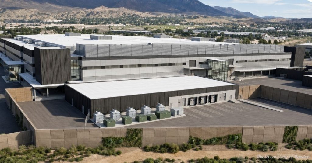 Aerial view of the Raeden Project Taurus data center in the former Intel plant near Colorado Springs homes and foothills.
