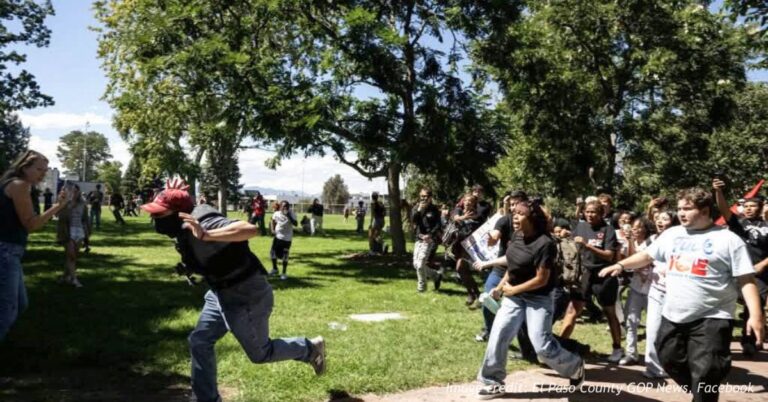 Crowd runs through La Alma-Lincoln Park during confrontations at a Denver anti-ICE student walkout.