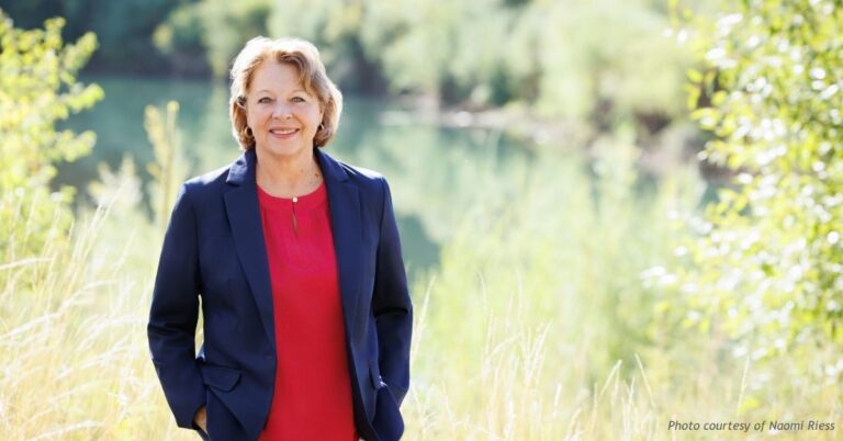 Naomi Riess, Republican candidate for Colorado House District 59, standing outdoors by a river