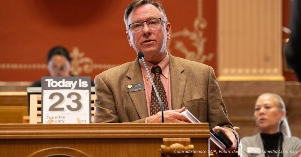 Colorado state Sen. Mark Baisley speaks from the podium on the Senate floor at the state Capitol in Denver.