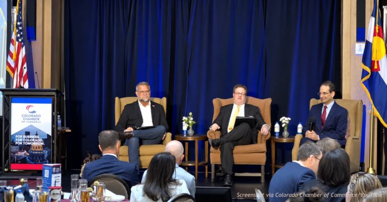 Victor Marx and Phil Weiser take questions from moderator Ed Sealover at the Colorado Chamber of Commerce forum in Denver